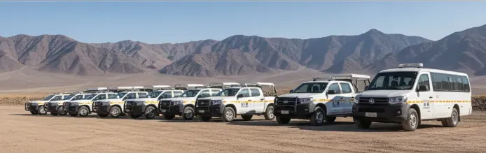 Vehículos modernos de transporte minero representando la financiación por leasing. Imagen ilustrativa de ACERO Y ROCA